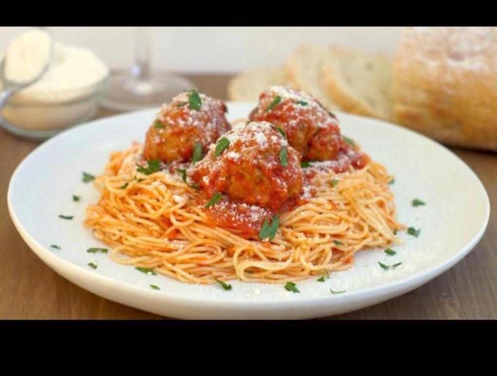 Pasta with Meatball · Baked spaghetti or penne pasta with Italian meatballs in marinara sauce. Topped with shaved Parmesan cheese. Served with garlic bread.