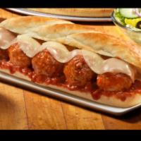 Italian Meatball Parmesan Sub · Italian meatballs topped with chunky marinara sauce with melted provolone on a toasted sub r...