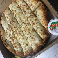 Breadsticks with Cheese · Served with our secret recipe pizza sauce and garlic butter sauce.