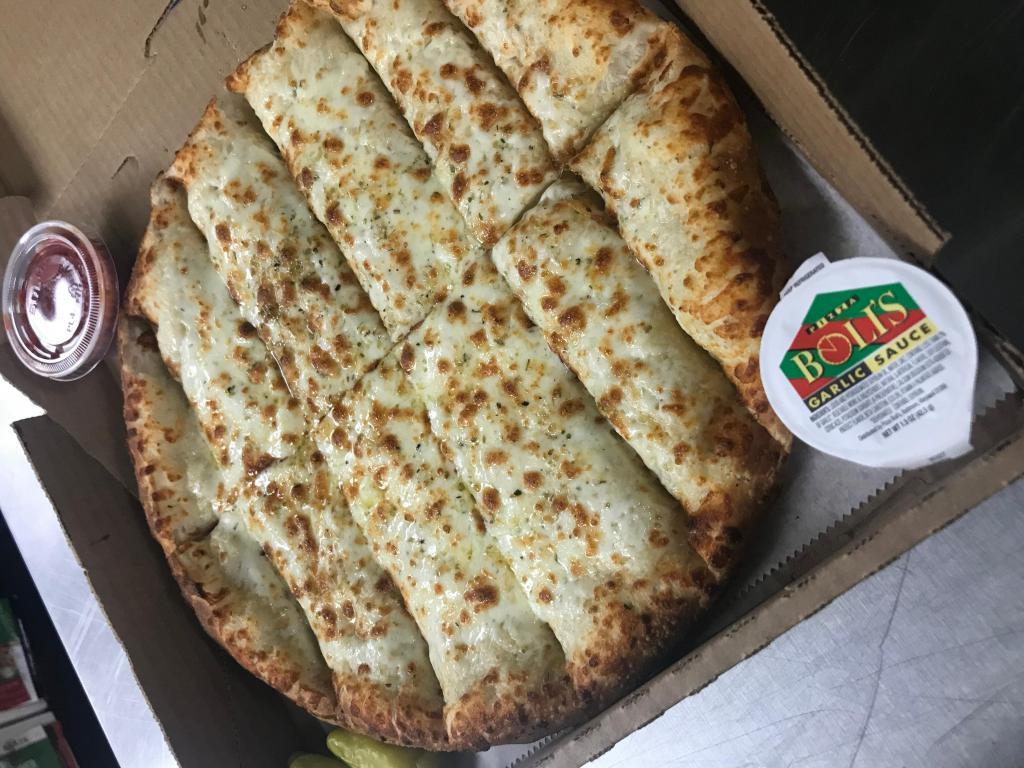 Bread Sticks with Cheese · Cheesy bread sticks are a totally irresistible side dish. Dough is brushed with butter, garlic and herb seasoning, then topped with lots of our special blend of 100% fresh natural Cheeses. 
