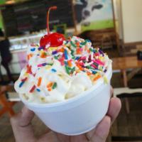 Screamery Sundae · A single scoop on top of a piece of cookie, brownie or buttercake and topped with whipped cr...