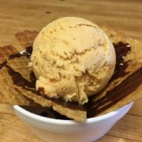 Ice Cream Nachos · Our homemade waffle chips topped with a single scoop of your choice and hot fudge.