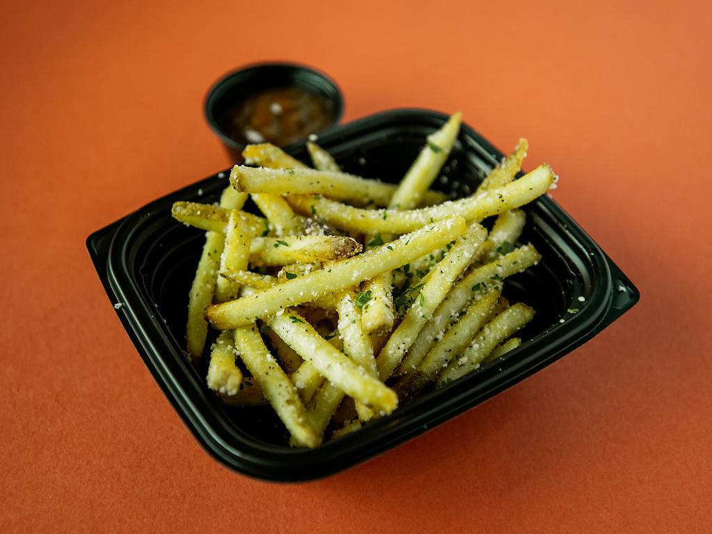 Parmesan Truffle Fries · Crispy fries, dusting of parmesan cheese, truffle oil, sea salt, signature ketchup.