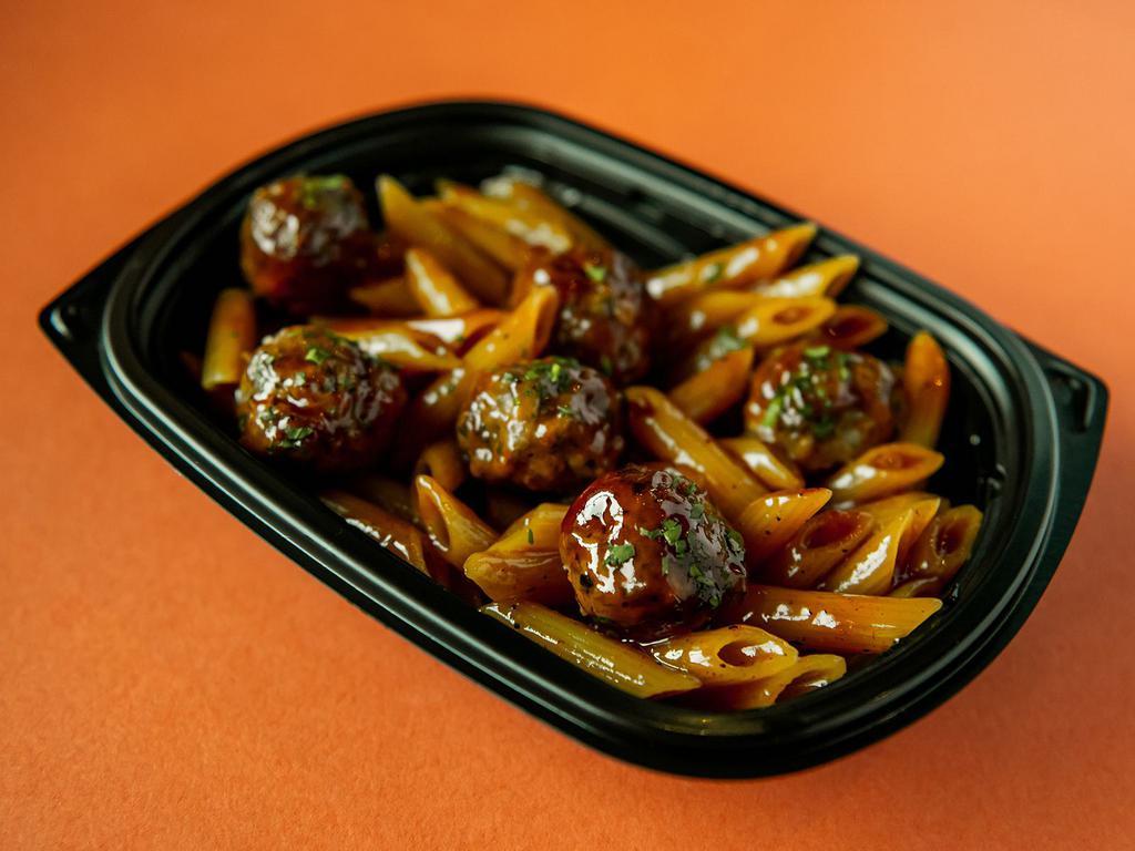 Classic BBQ Meatball Bowl · Beef, veal, pork & ricotta meatballs tossed with sweet and tangy BBQ sauce. Served on a bed of penne pasta or power greens (spinach, broccolini, peppers, onions and garlic).