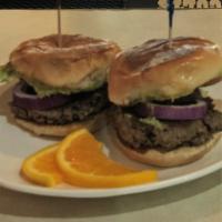 Impossible Guac Sliders · Two juicy 2oz Veggie patties placed on grilled buns, dressed with a guacamole spread & toppe...