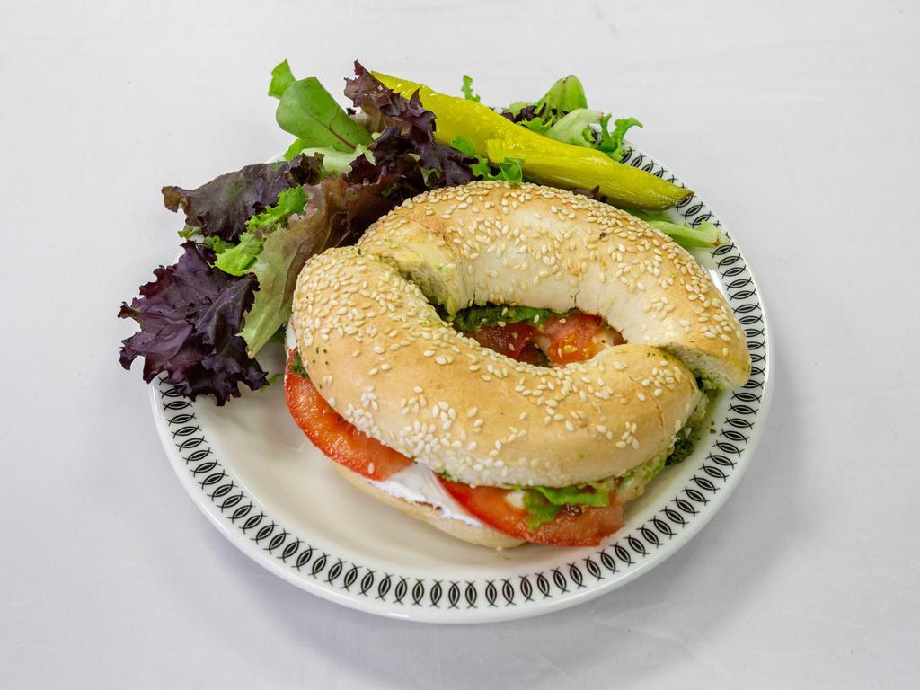 Revolution Bagel · Bagel of your choice topped with our amazing basil pesto, cream cheese, avocado, and fresh tomato slices.