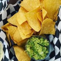 Chips & Guacamole · Freshly made chips with eight ounces of our homemade guacamole.