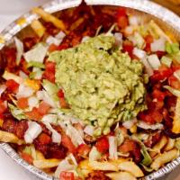 Carne Asada Fries · Fries topped with carne asada, melted Monterrey & cheddar cheese & guacamole.