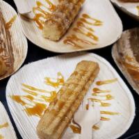 Churros · Four deep fried churro sticks covered in cinnamon sugar and topped with caramel. Served with...