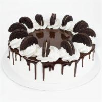 Oreo Cookies Cake · Serves 10-12. Two delicious froyo layers, and a luscious filler layer, on a chocolate or whi...