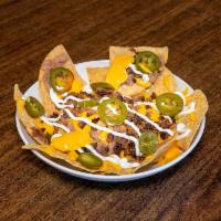 Nachos · Beans,Chicken, Nacho Cheese,Sour Cream & Jalapeño.Extra topping extra charge