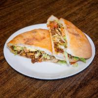 Torta de Carne Asada · Steak,Lettuce, Tomatoes, Avocado,Beans
& Sour Cream.Extra topping extra charge