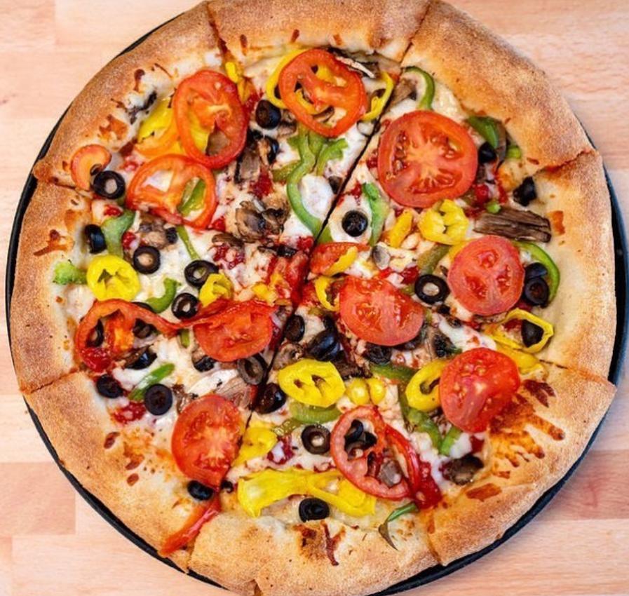 The Garden Supreme Specialty Pizza · Italian sauce, select blended cheeses, onion, green pepper, mushrooms, black and green olives, Roma tomatoes and banana peppers. Vegetarian.