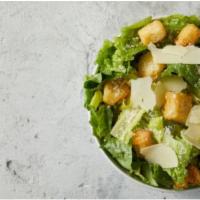 Small Caesar Salad · Small bowl with romaine lettuce topped with croutons parmesan cheese and Caesar dressing 