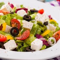 Greek Salad  · Romaine and Iceberg lettuce, plum tomatoes, black olives, feta cheese, and radishes mixed wi...
