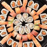 TOKYO PLATTER · A combination platter with: Shrimp Nigiri, California Roll†, Spicy Tuna Roll* & Rainbow Roll†*