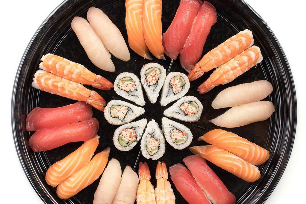 TSUKIJI PLATTER · A combination platter with: California Roll†, Tuna Nigiri*, Yellowtail Nigiri*, Salmon Nigiri*, and Shrimp Nigiri