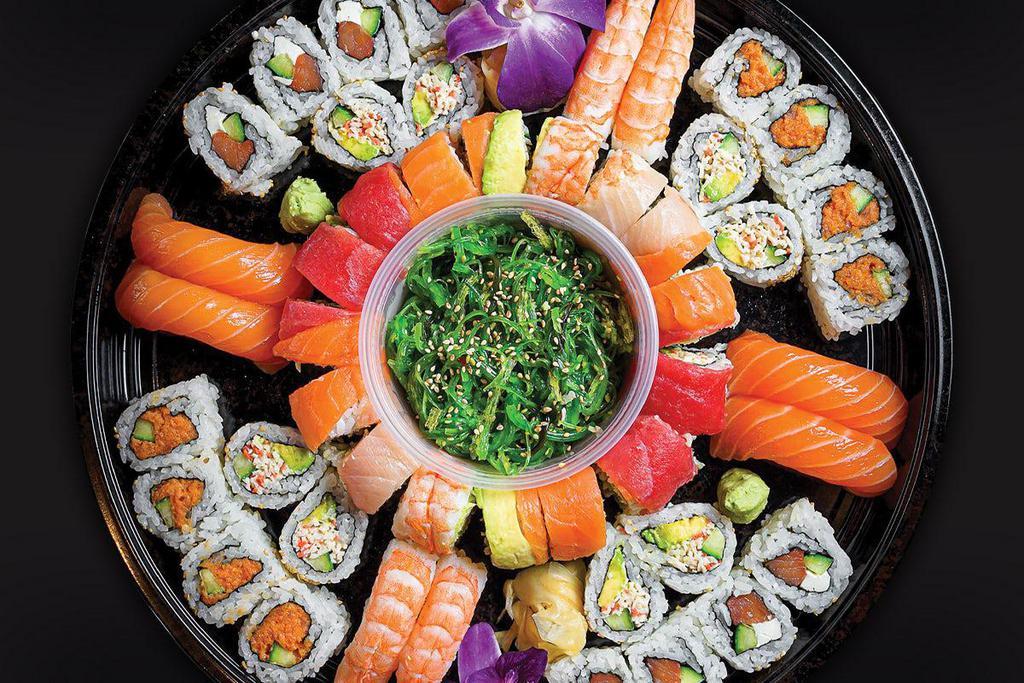 SUSHI O'CLOCK PLATTER† · Comes with: 
- Seaweed Salad 
- Shrimp Nigiri 
- Salmon Nigiri
- California Roll
- Philadelphia Roll
- Spicy Tuna Roll
- Rainbow Roll 
