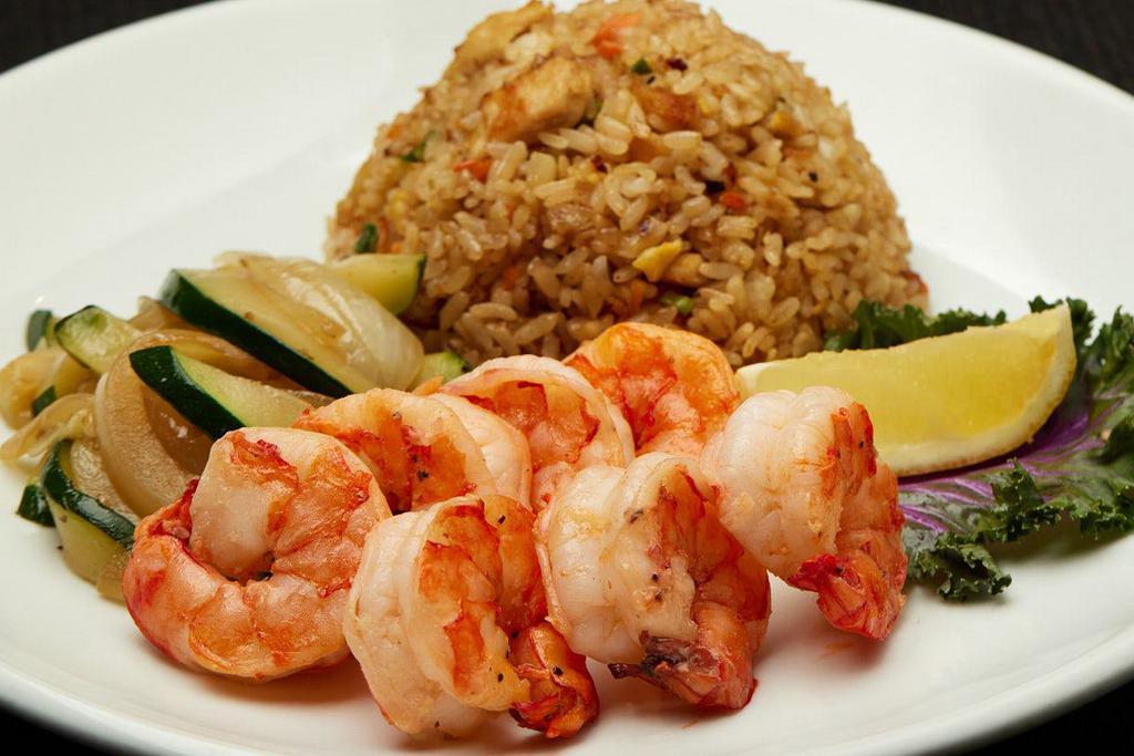 HIBACHI COLOSSAL SHRIMP · Served with hibachi vegetables, “RA”ckin’ Fried Rice and homemade dipping sauces.