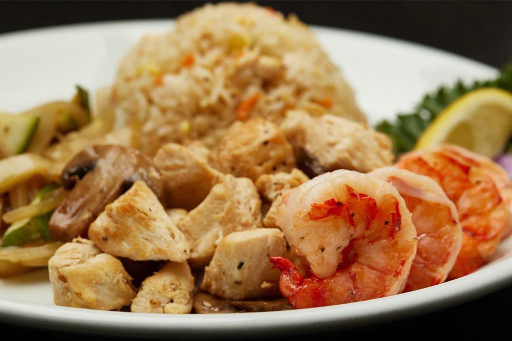 HIBACHI CHICKEN & COLOSSAL SHRIMP · Served with hibachi vegetables, “RA”ckin’ Fried Rice and homemade dipping sauces.