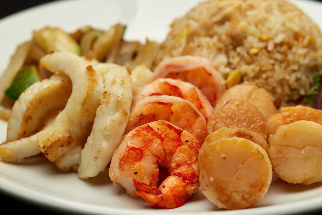 CALAMARI, SCALLOPS, & COLOSSAL SHRIMP · Served with hibachi vegetables, “RA”ckin’ Fried Rice and homemade dipping sauces.
