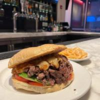 Asada Torta · French bread, refried pinto beans,  chihuahua cheese, tomato, avocado, mayo, grilled steak, ...
