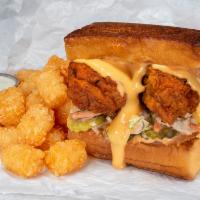 The Cheesy Chick Combo · BBMC sandwich with a choice of fries, tots, hot fries or hot tots and a dipping sauce