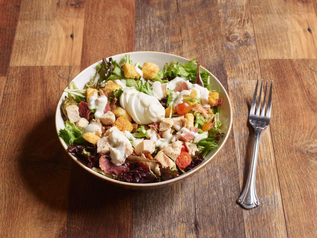 Cobb Salad · Mixed greens, grilled chicken, bacon, avocado, hard boiled egg, avocado, tomatoes and croutons with blue cheese dressing.