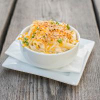 Smoked Gouda Mac · Penne pasta, Monsieur Poutine famous smoked Gouda mornay, cheddar cheese and scallions. Vege...