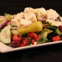 House Salad · Romaine lettuce, tomatoes, red onion, black olives, pepperoncini and cucumber.