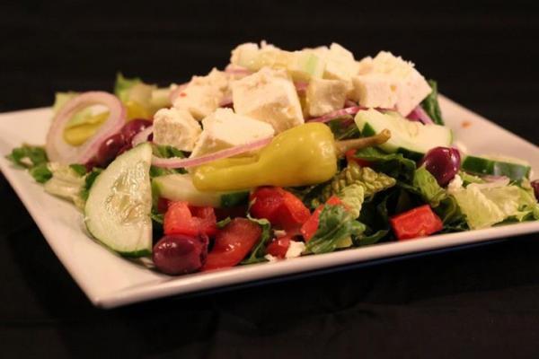 House Salad · Romaine lettuce, tomatoes, red onion, black olives, pepperoncini and cucumber.