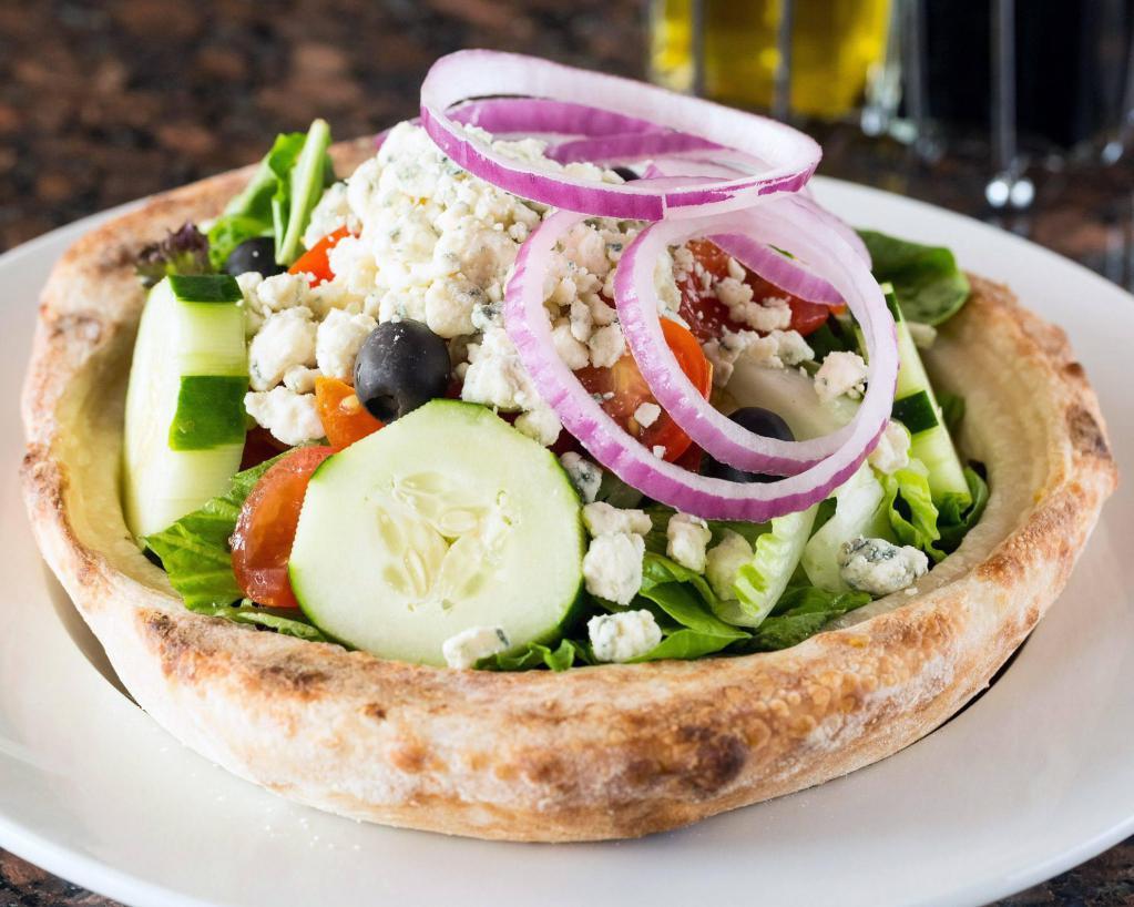 Gorgonzola Salad · Field green lettuce, gorgonzola cheese, red onions, black olives, cucumber and tomatoes served in a homemade bread bowl. 