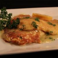 Francese · Egg battered and sauteed in a lemon white wine sauce. Served with a side of spaghetti.