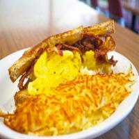 Breakfast Sandwich · Scrambled eggs and cheese served on choice of bread, choice of 1 meat, bacon, sausage, or ha...