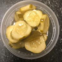 Peche Pickles · House made pickles made with our sour peche beer and spices.