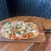 Pepperoni Flatbread · Oven Baked Flatbread, House Made Red Sauce,  Pepperoni, Ricotta and our House Cheese blend T...
