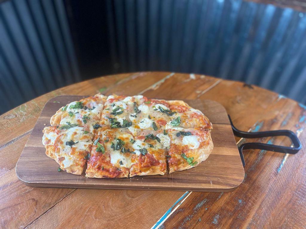 Pepperoni Flatbread · Oven Baked Flatbread, House Made Red Sauce,  Pepperoni, Ricotta and our House Cheese blend Topped with Fresh Basil