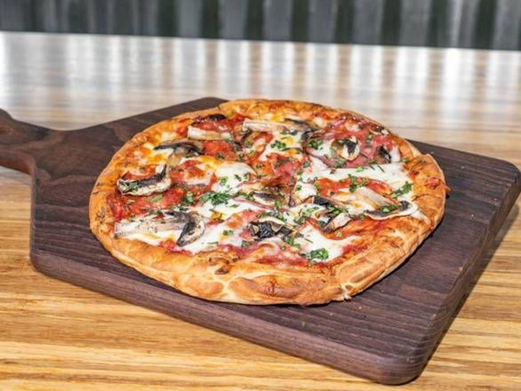 Pepperoni & Mushroom Flatbread · Oven Baked Flatbread, House Made Red Sauce, Sauteed Baby Bella Mushrooms, Pepperoni, Ricotta and our House Cheese blend Topped with Fresh Basil