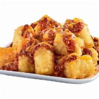 CHILI CHEESE PARTY TOTS · Sink your teeth into these crispy, golden tots piled high with Krystal’s chili and then topp...