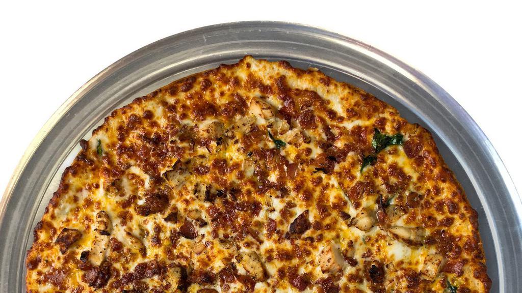 Extra Large Chicken Ranch Pizza · Spinach, chicken, bacon, Wisconsin cheddar, and ranch sauce.