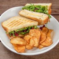 Carter Sandwich Lunch · Turkey, Gouda, cranberry, pesto aioli greens, orange relish and sourdough bread.
