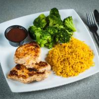 Grilled Chicken Breast Dinner · 2 grilled white chicken breast served with rice and broccoli.
