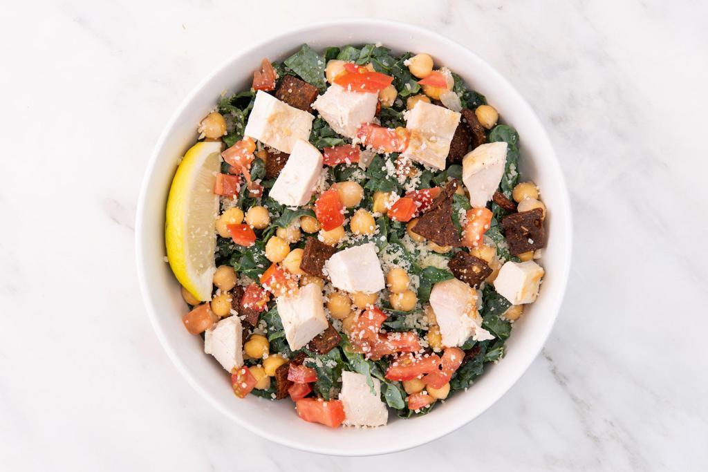 Kale Caesar Salad · Shredded kale, parmesan cheese, chickpeas, diced tomatoes, organic caesar dressing, lemon wedge. Served with your choice of roasted antibiotic-free chicken or roasted sesame tofu. (gluten-free)