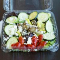 Greek Salad · Crisp greens with Greek olives, cucumber, tomatoes, feta cheese and red onion with Greek dre...
