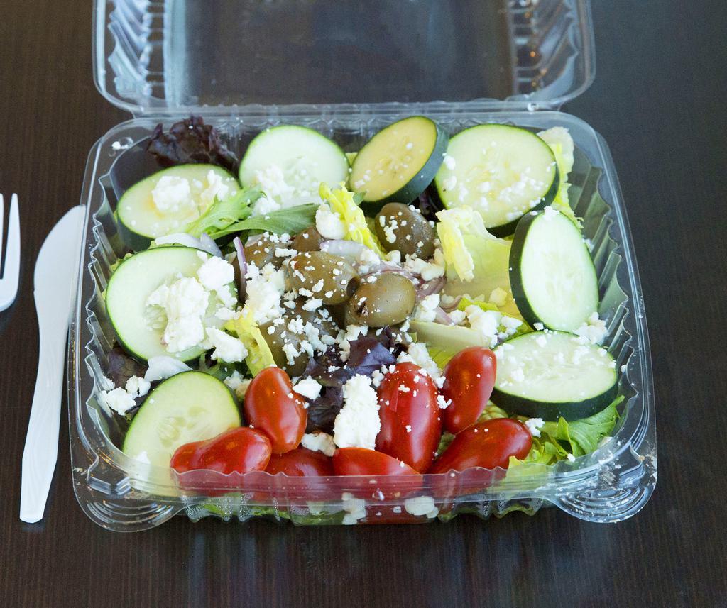 Greek Salad · Crisp greens with Greek olives, cucumber, tomatoes, feta cheese and red onion with Greek dressing.