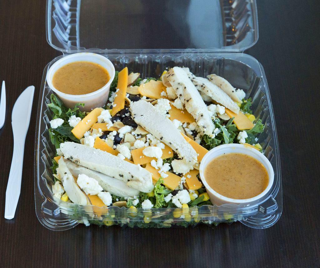 New Mexico Baby Kale Salad · Baby kale, blackened chicken breast, red onion, almonds, feta and cheddar cheese, black beans and corn with chipotle lime vinaigrette.