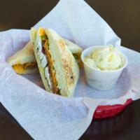 Spicy Blackened Chicken Panini · Blacked chicken with bacon, cheddar cheese, jalapenos and spicy ranch dressing. Served on ci...