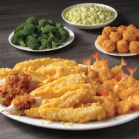 Seafood Feast · 12 pieces of our famous batter dipped fish, 12 crispy butterfly shrimp, 3 seafood stuffed cr...