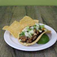 Carne Asada Taco · Grilled marinated angus steak, onion-cilantro, salsa served on a large 5” yellow corn tortil...