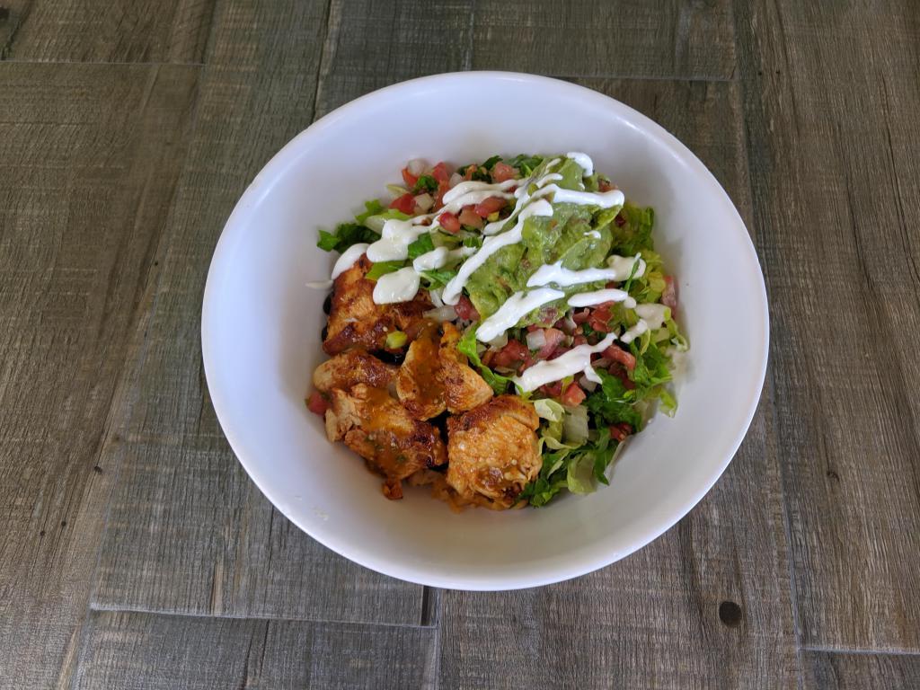 Grilled Chicken Burrito Bowl · Grilled marinated chicken breast, rice, Jack cheese, salsa, and, lettuce choice of pinto or black beans served with sides of pico de gallo, guacamole and sour cream.
